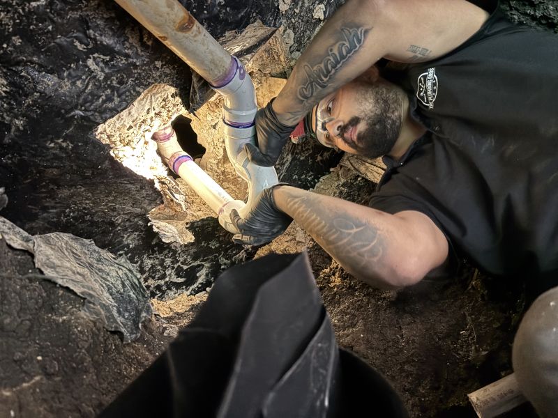 a Plumbing Bros technician completes a slab leak repair in a tunnel under a home in San Antonio