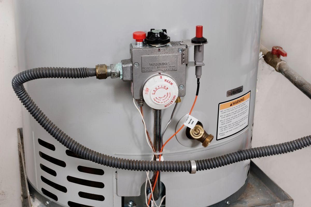 plumber-22-2 a traditional water heater in need of maintenance